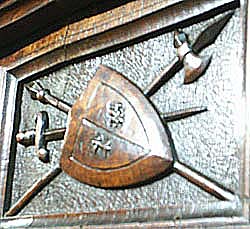 3091-shield and sword on antique cabinet
