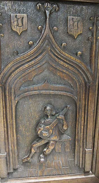 5106-troubadour carving on gothic cabinet