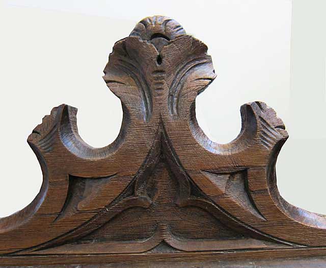 detail of top of chestnut cabinet