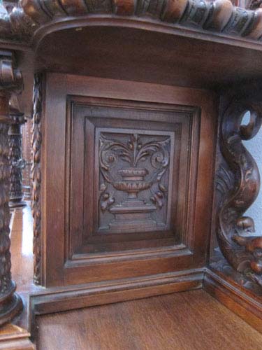5171-vase motif on heavily carved walnut cabinet