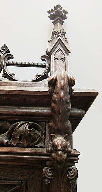 5193-upper right corner of armoire with crouching dog