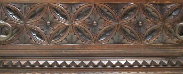 5205-detail of fenestrage at base of antique armoire