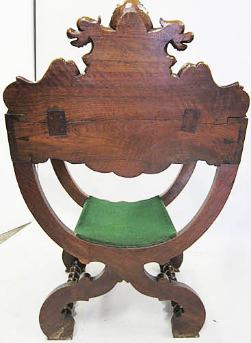 4193-back view of carved antique armchair