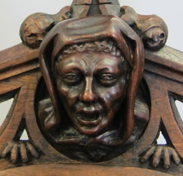 5195-carved face and hands emerging from chair