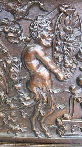 satyr on left of antique chest