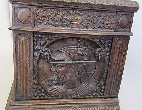 male medallion on antique chest