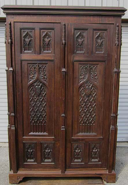 antique armoire heavily carved