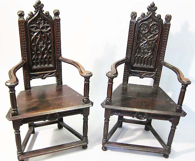 pair of french gothic revival armchairs heavily carved