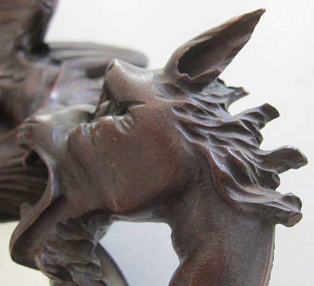 detail of dragon's head on mirror